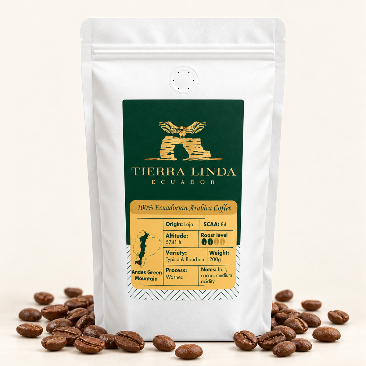 Andes Green Mountain coffee beans in a white valve bag with roasted beans around the base