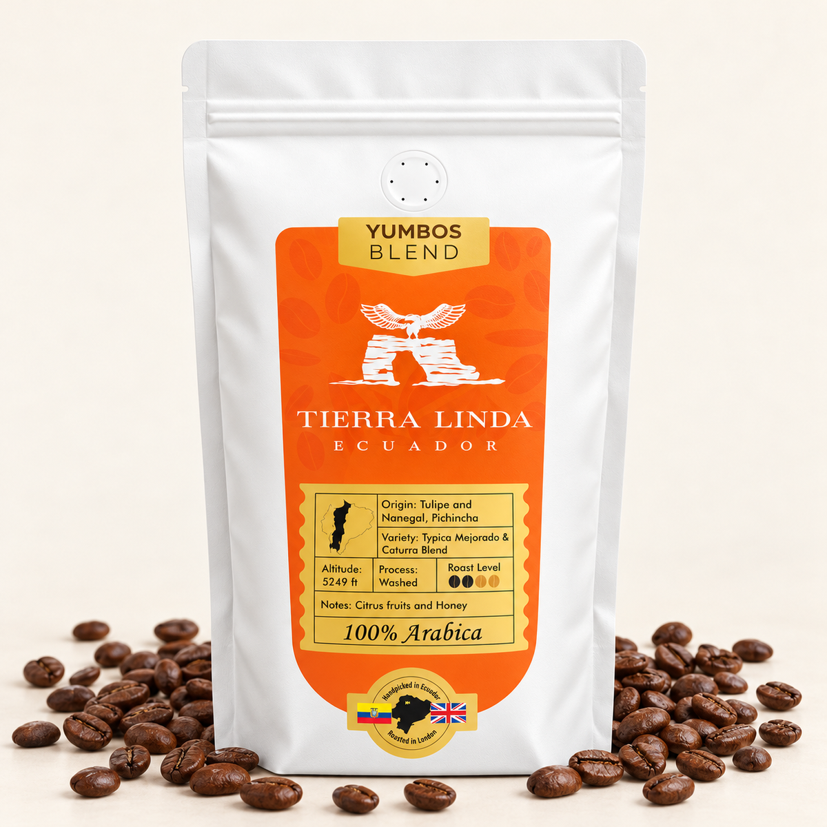 Yumbos Blend coffee beans in a uniform white valve bag with orange label and roasted beans